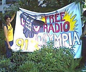 free radio olympia unfurls banner in freeway park